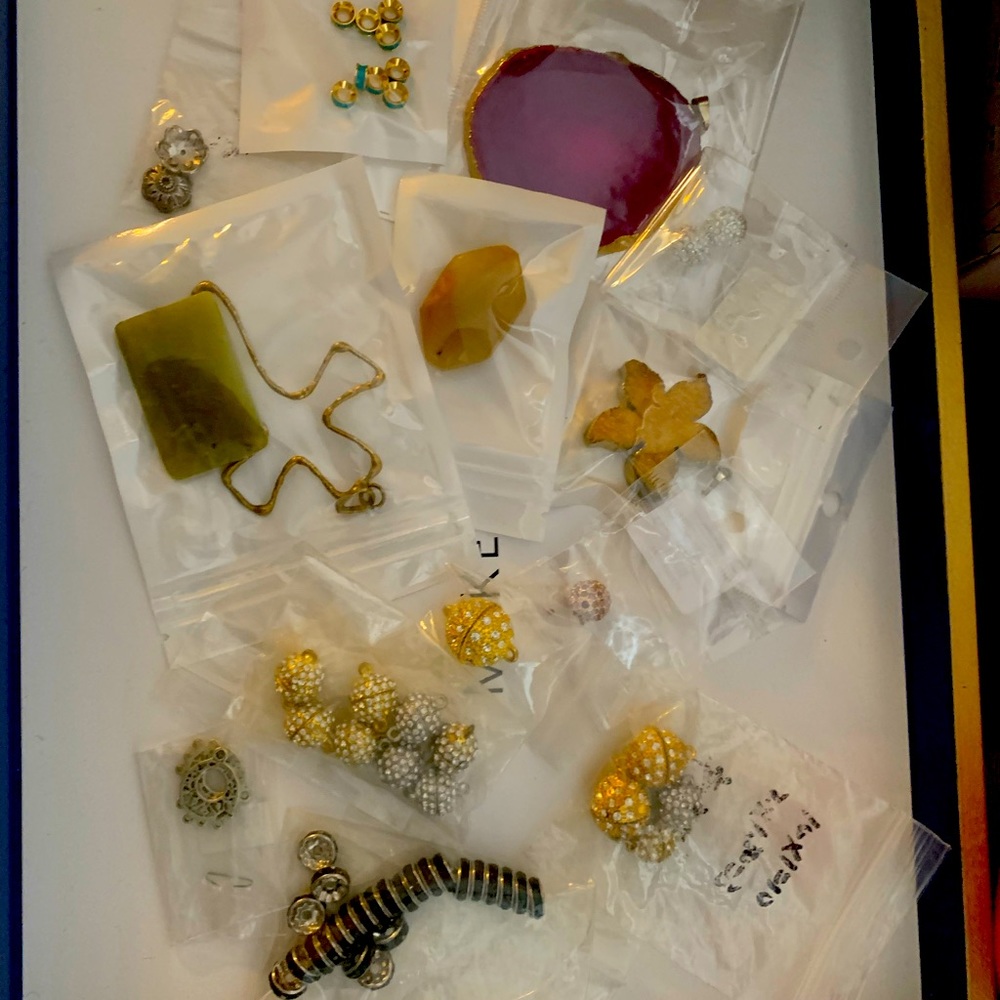 Jewelry beads, magnetic closures, pendants, and more pieces.